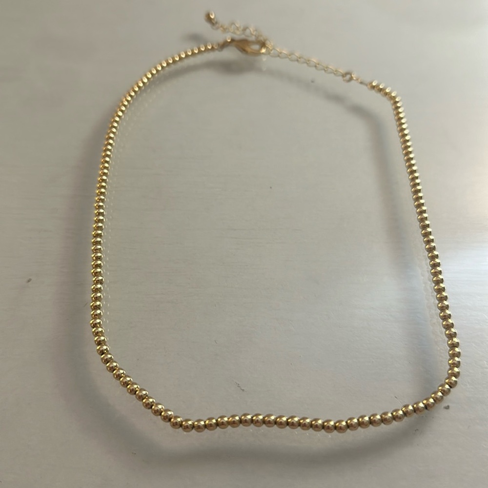 Gold Beaded Necklace.